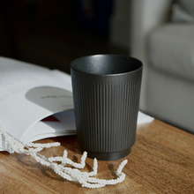 Load image into Gallery viewer, Black Ceramic Tumbler Cup with Ribbed Texture. Artifact Home www.artifacthome.ca