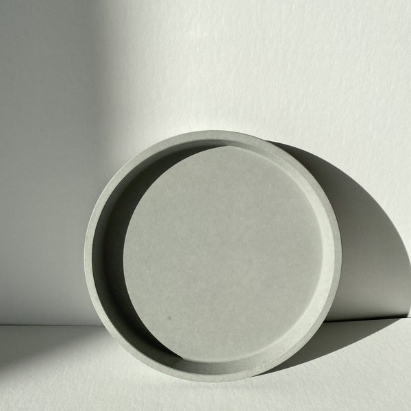 Artifact Home www.artifacthome.ca  Grey round concrete tray minimalist home decor