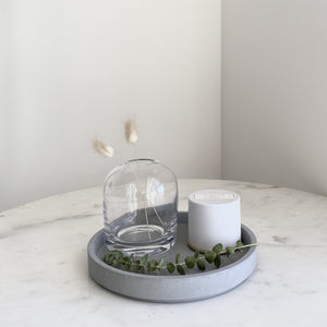 Mouth blown and handblown clear glass bud vase home decor and grey concrete tray styling coffee table
