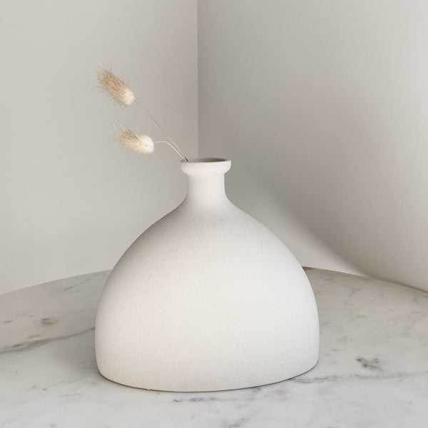 Artifact Home www.artifacthome.ca @artifacthome_ Minimalist ceramic white vase inspired by nordic aesthetics neutral home decor